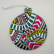 Hand-painted 4.25-inch ornament by Mary-Jo Lough featuring bold colors and intricate patterns, adding a unique touch to holiday decor.