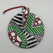Hand-painted 4.25-inch ornament by Mary-Jo Lough featuring bold colors and intricate patterns, adding a unique touch to holiday decor.