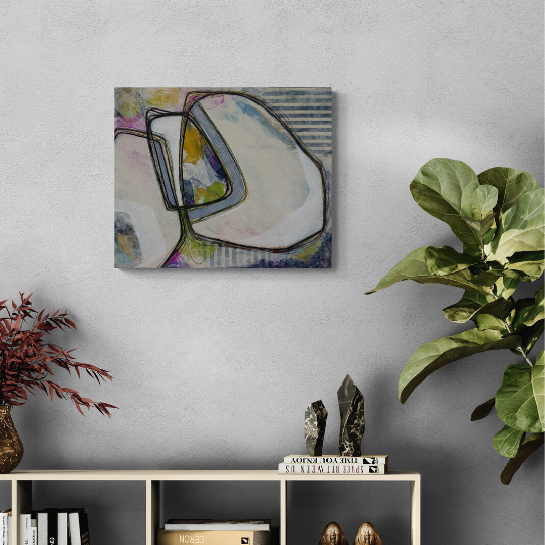 Abstract painting on a wall with decorative items below